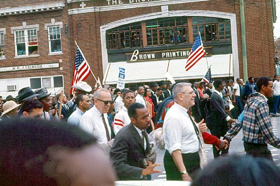 marchers holding hands