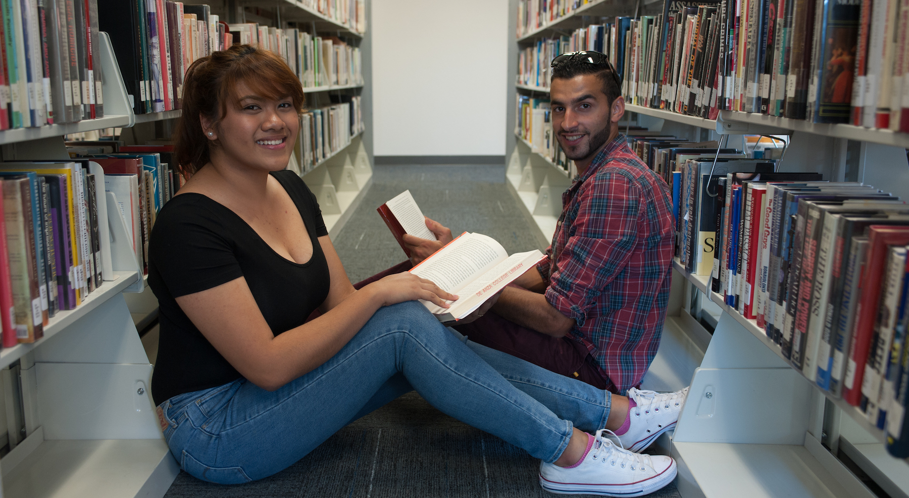 students reading in library