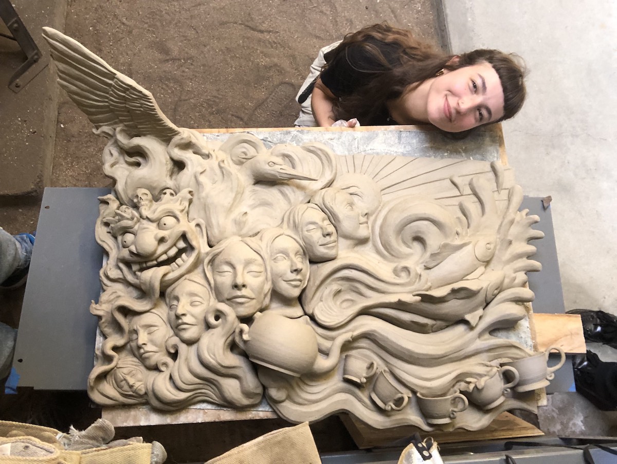 student with sculpture