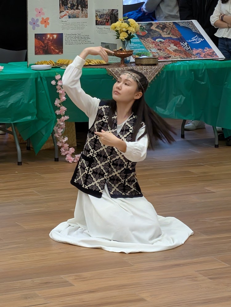 young woman in white kneeling